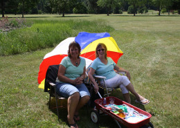 Mary Cheney and Judy Lovse -Watching for a Hole-in-One. A hole-in-one at hole #8 would ensure the winning of a Yamaha Side by Side, 4-Wheeler valued at $14,000 donated by Boundary Tractor Co.