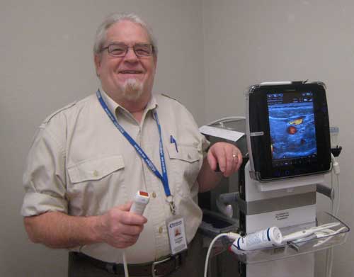 Dr. Stu Willis, Emergency Department Director, demonstrates the new Mobile Ultrasound purchased by Fry Healthcare Foundation for the Emergency Department at Boundary Community Hospital.